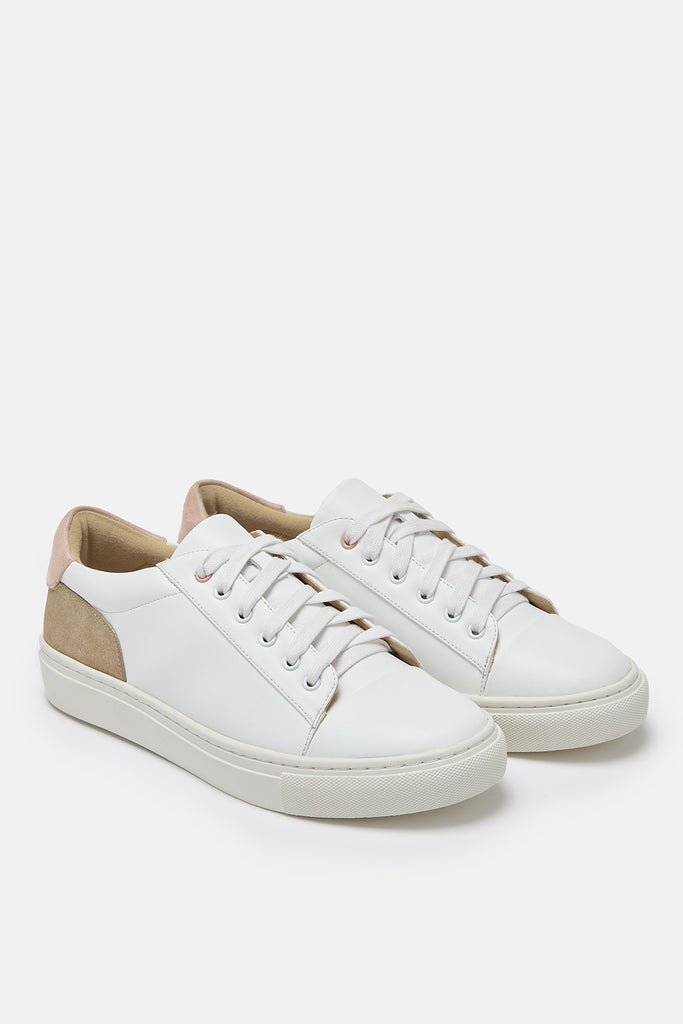 pair of white vegan leather trainers with gold and pink heel detail