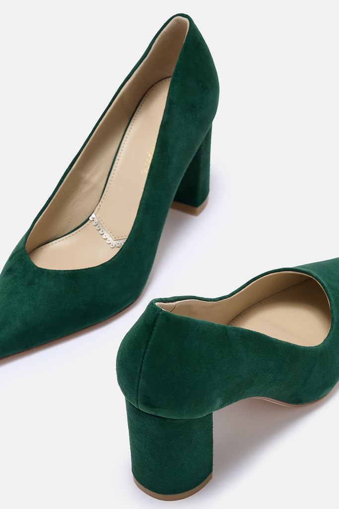 Green high-heeled shoes on a white background