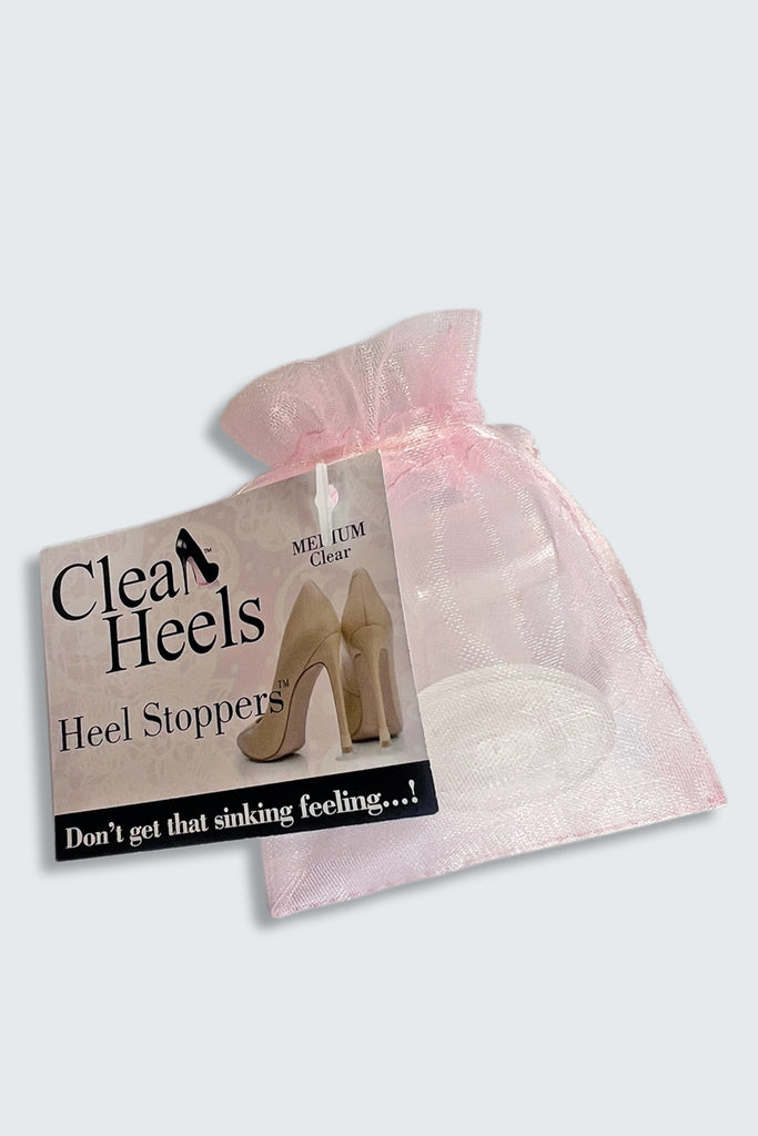 Clean Heels heel stoppers packaging with a pink drawstring bag on a light gray background