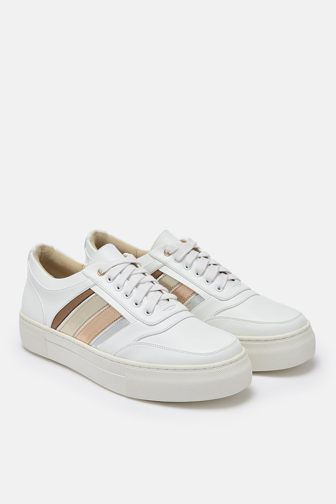 Pair of white vegan leather trainers with side stripes in bronze, gold, rose gold and silver.