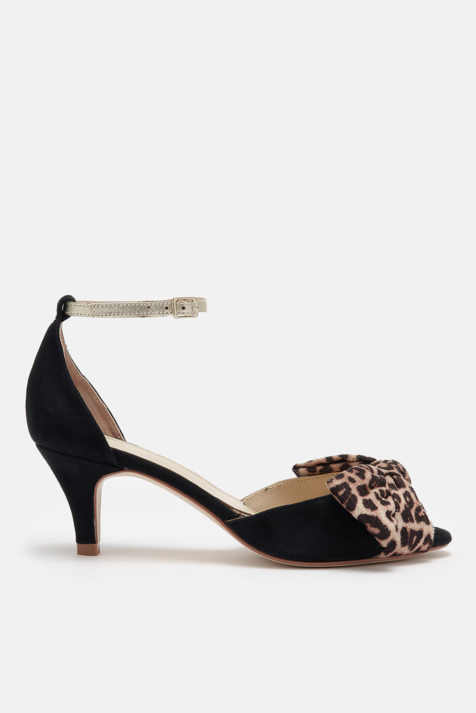 black suede low heel two part occasion shoe with oversized leopard bow and gold leather ankle strap- side view