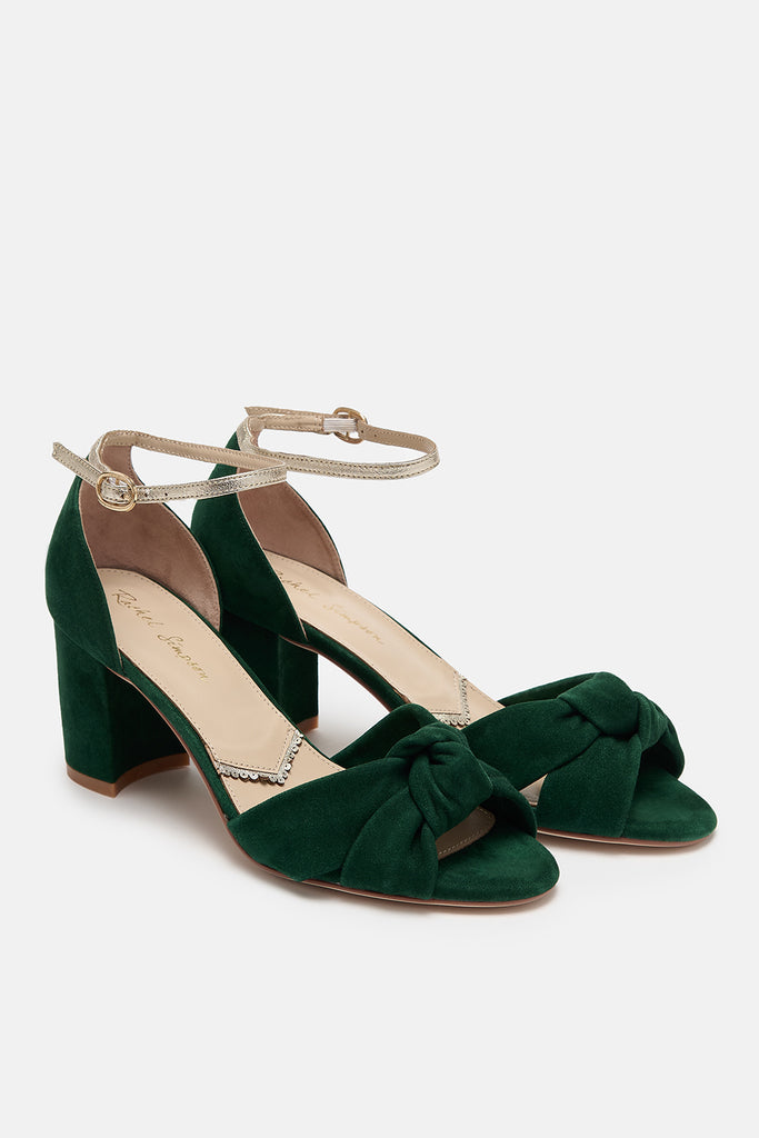 pair of forest green suede block heel shoes with knot detail and gold leather ankle straps