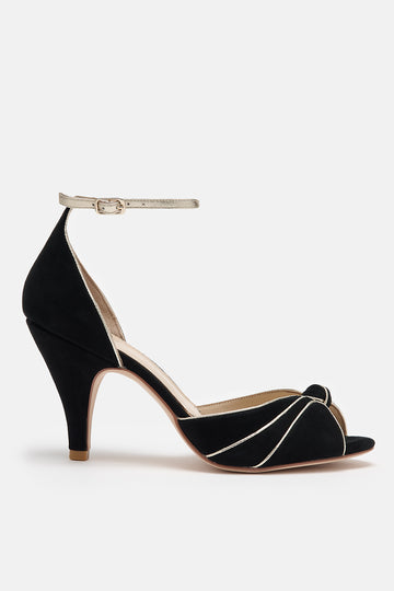 black and gold suede occasion shoes with vintage inspired knot detail, mid heels and gold leather ankle strap- side view