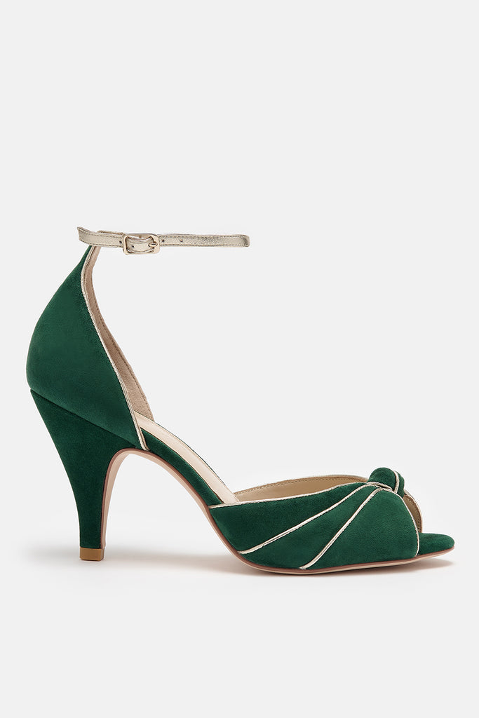 forest green and gold two part occasion shoe, with vintage inspired knot detail, mid heel and gold leather ankle strap- side view