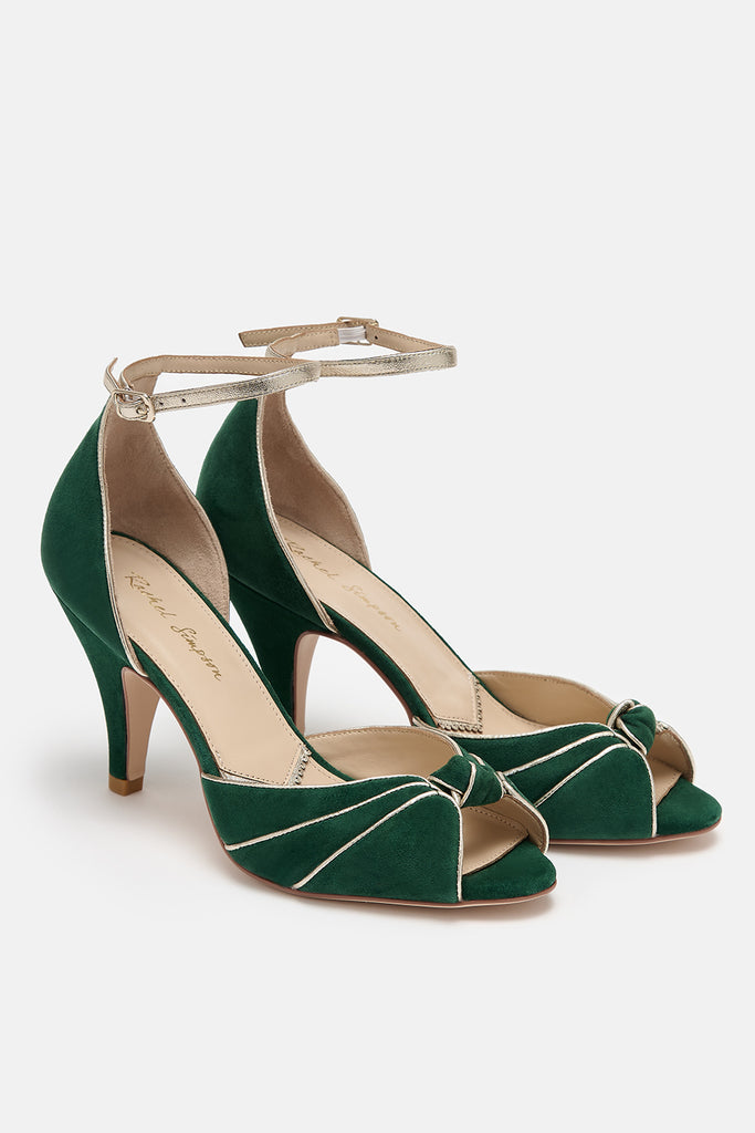 pair of forest green and gold two part occasion shoes, with vintage inspired knot detail, mid heels and gold leather ankle straps