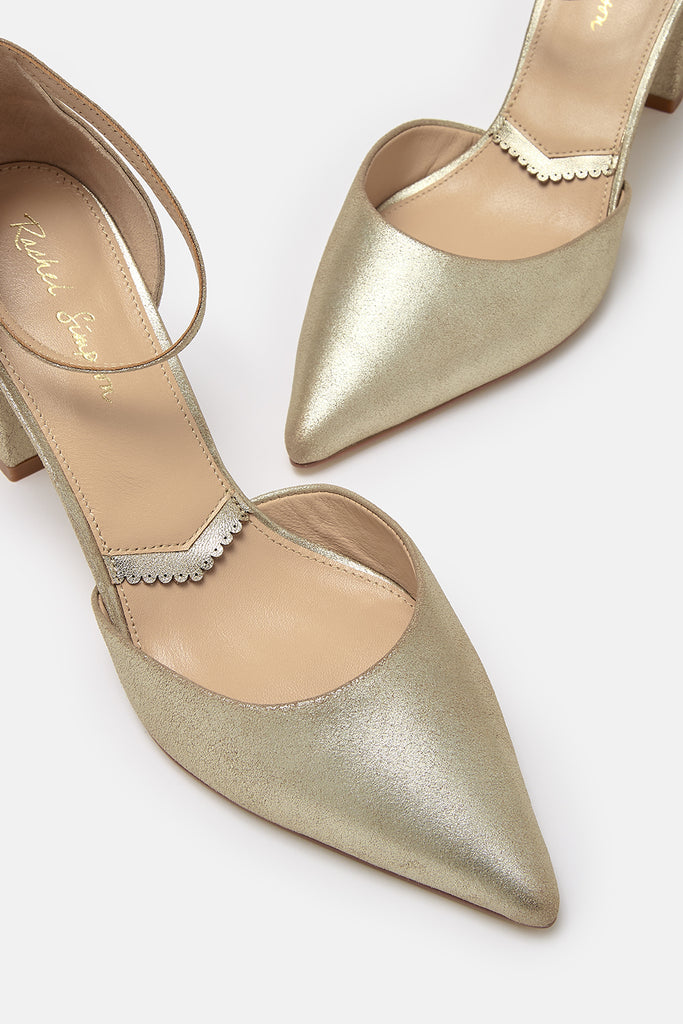 close up detail shot of a pair of antique gold leather two part pointed occasion shoes with block heels and ankle straps